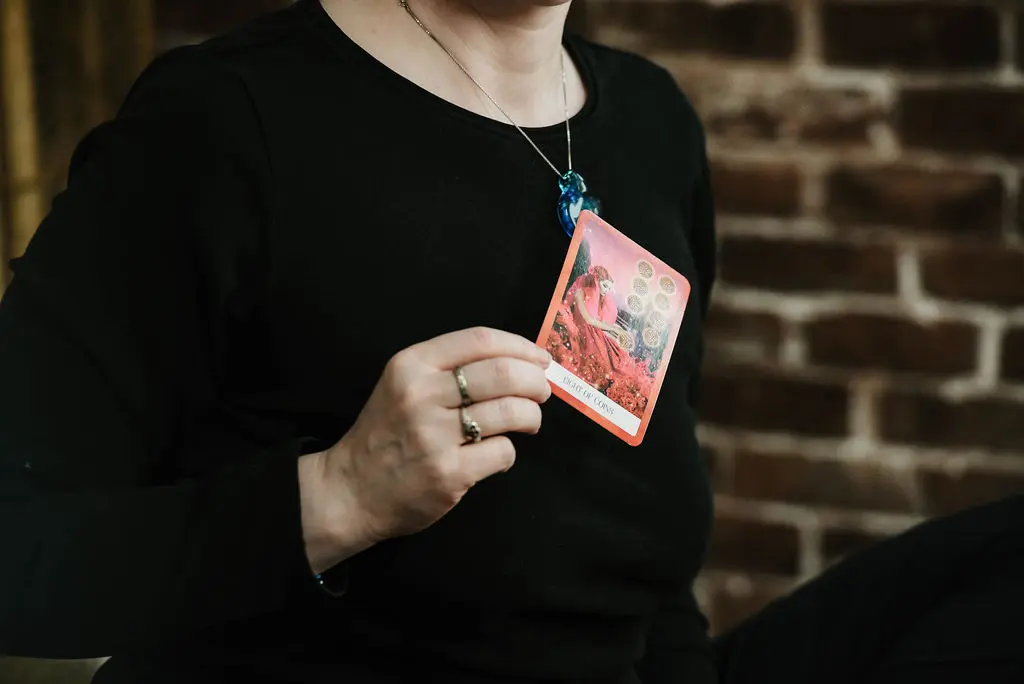 What_Will_Your_Intuitive_Reading_Give_You Photograph of Danielle holding a card from a card deck