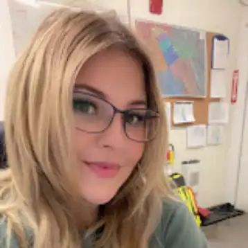 young blond girl wearing glasses